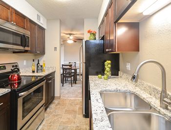 Kitchen with dishwasher, microwave, and oven